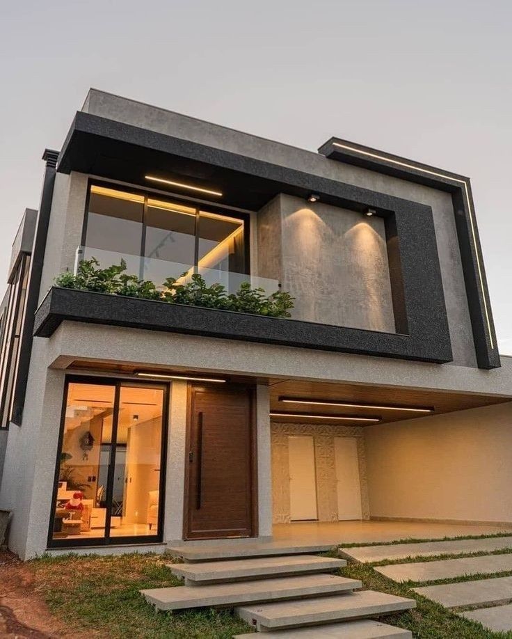 Vivienda de dos pisos con ventanales de piso a techo y baranda de vidrio templado en el balcón